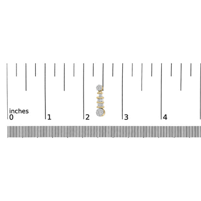 Close-up front view of a yellow metal earring with white round gemstones in prong settings on the top and bottom and white baguette gemstones in channel settings in the middle, placed on a ruler for size reference.