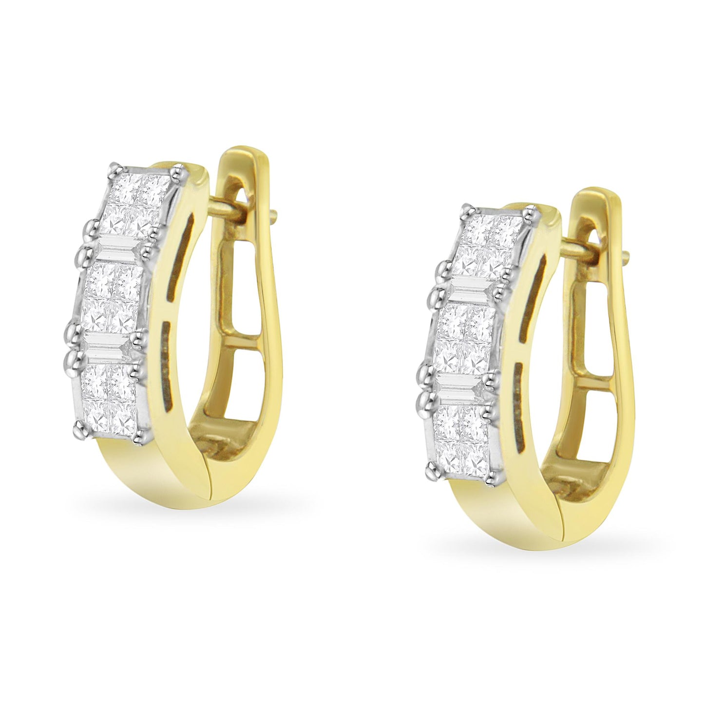 Pair of yellow metal hoop earrings with front-facing white gemstones in baguette shape with prong settings and princess shape with invisible settings, shown at a slight angle.