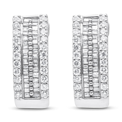 Front-facing view of white metal earrings featuring rows of round white gemstones in pave settings on the outer edges and baguette-shaped white gemstones in channel settings in the center.
