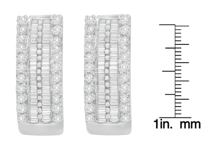 Pair of white metal earrings with a combination of round pave set white gemstones on the edges and channel set baguette white gemstones in the center, shown in a front-facing view next to a ruler for size reference.