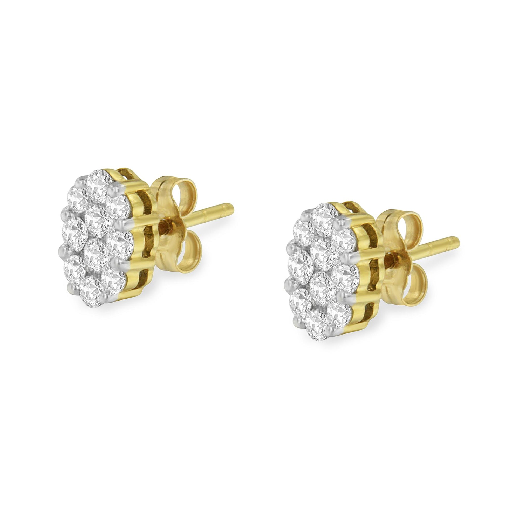 Pair of yellow metal stud earrings with clusters of round white gemstones in prong settings, shown from an angled side view.