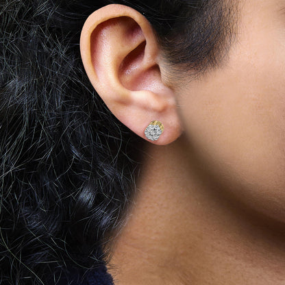 Close-up side view of a yellow metal earring featuring multiple round white gemstones in a cluster setting, worn on a model's ear.