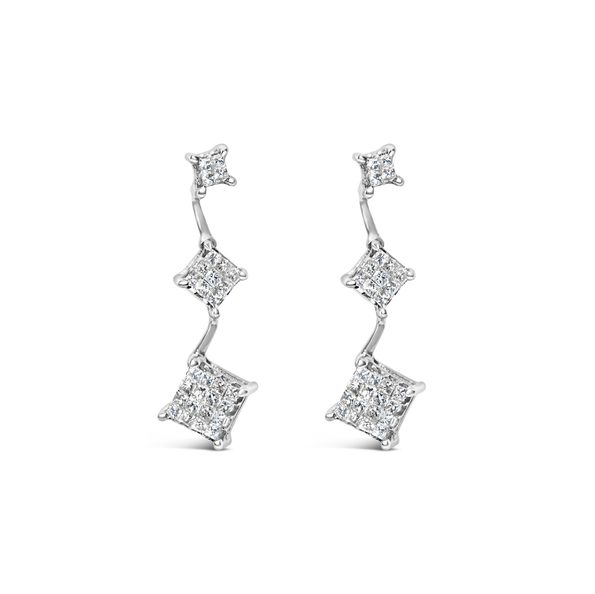 Front view of a pair of white metal earrings with three connected square sections, each featuring clustered white gemstones in an invisible setting.