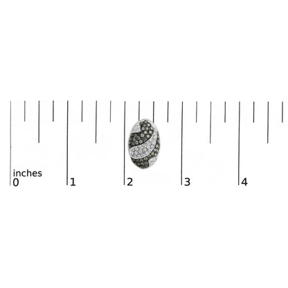 White metal oval earring with a curved swirl design of white and blue round gemstones, shown on a scale from a top-down angle.