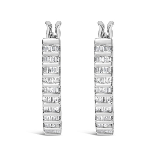 Front-facing view of a pair of white metal hoop earrings with multiple rows of channel-set baguette-shaped white gemstones.