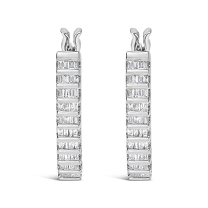 Front-facing view of a pair of white metal hoop earrings with multiple rows of channel-set baguette-shaped white gemstones.