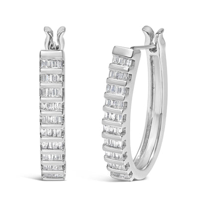 Pair of white metal hoop earrings with channel-set baguette-shaped white gemstones, shown from front and three-quarter angles.