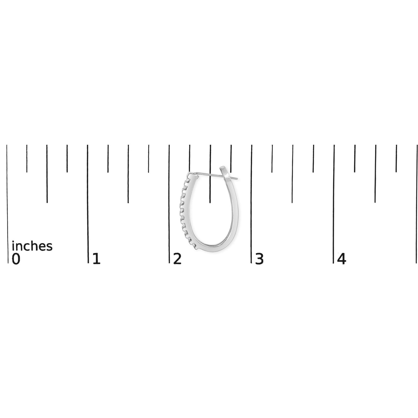 Close-up of one white metal earring with channel-set white baguette-shaped gemstones placed next to a ruler for size reference.