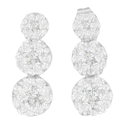 Pair of white metal earrings with three clusters of round white gemstones in prong settings, shown from a front angle.