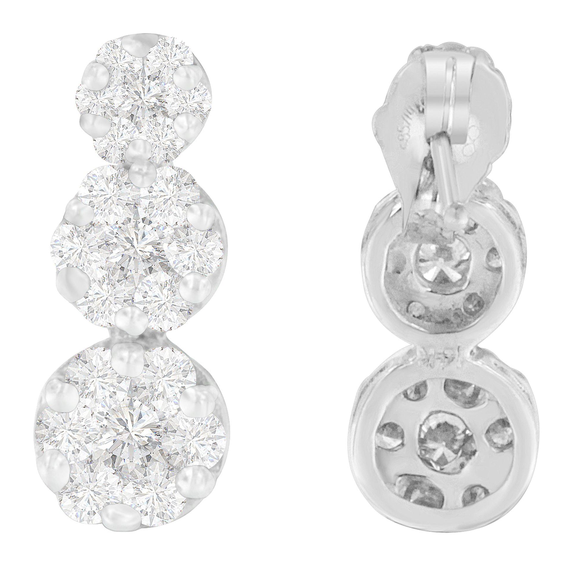 Front and back view of white metal earrings with clusters of round white gemstones in prong settings.