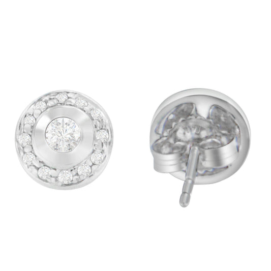Front and back angled view of round white metal stud earrings with central round white gemstone in bezel setting surrounded by smaller round white gemstones in prong settings.