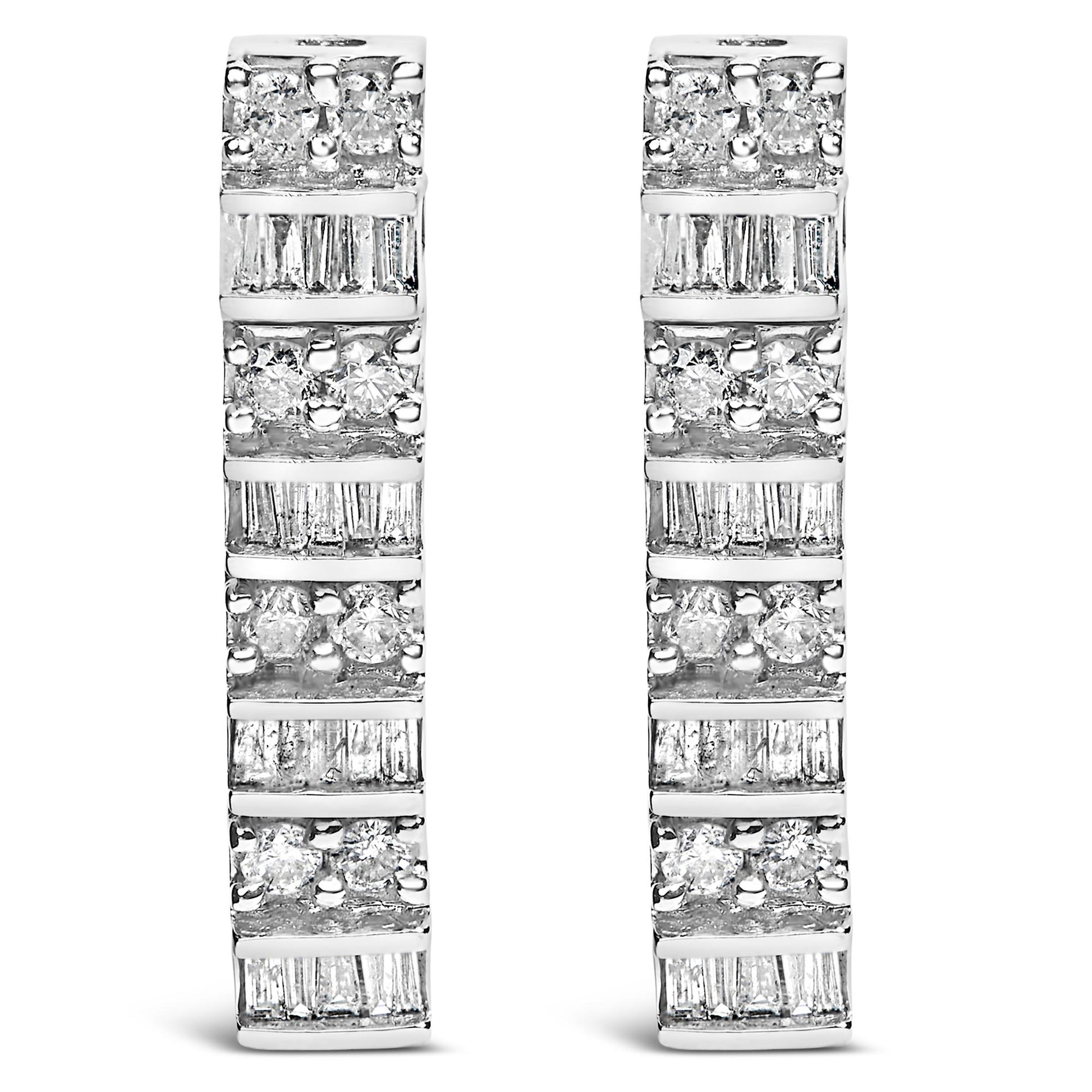 Front-facing view of white metal earrings with alternating rows of round white gemstones in prong settings and baguette white gemstones in channel settings.