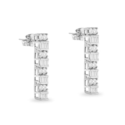 Pair of white metal earrings with alternating round prong-set white gemstones and baguette channel-set white gemstones, shown from a slightly angled front view.