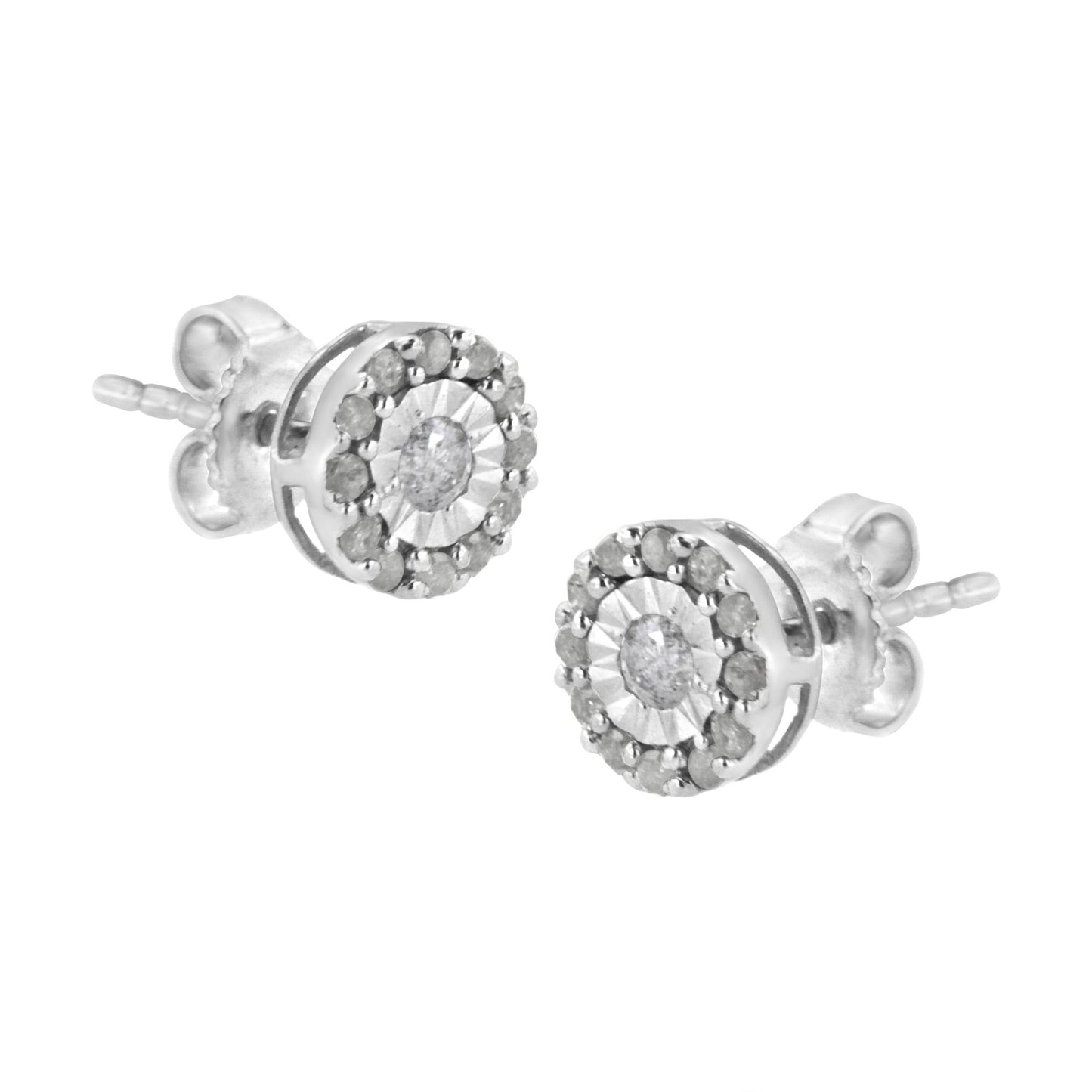 Pair of white metal stud earrings with round white gemstones in a central setting, surrounded by smaller round white gemstones, shown from a slightly angled side view.