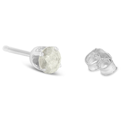 Close-up front angle of a white metal stud earring with a round prong-set white gemstone and a separate earring back.