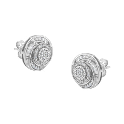 Front angled view of white metal circular stud earrings featuring concentric swirl design with round and baguette white gemstones in prong and channel settings.