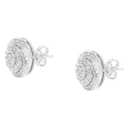 Pair of white metal stud earrings with concentric circular design featuring round and baguette-shaped white gemstones, shown at a slight angle.