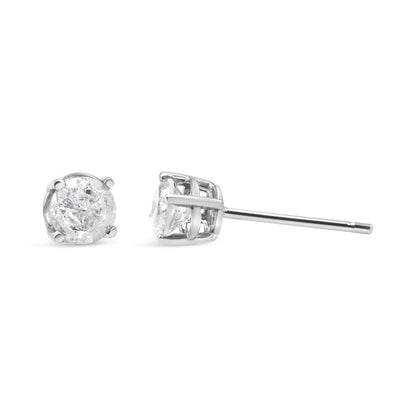 Pair of white stud earrings with round white gemstones in prong settings, shown from the front and side on a white background.
