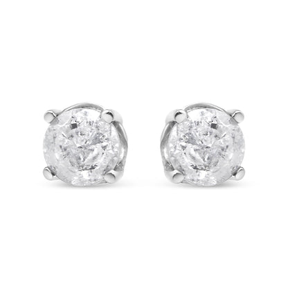 Front-facing close-up of a pair of white metal stud earrings with round white gemstones in a prong setting.