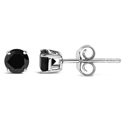 Close-up front and side view of round black gemstone stud earrings in white metal with four-prong settings shown on a white background.