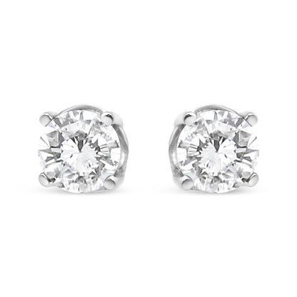 Front view of a pair of white metal stud earrings featuring round white gemstones in a four-prong setting.