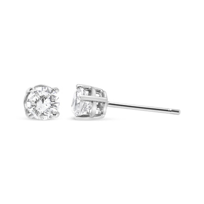 Close-up front and side view of white metal stud earrings featuring round white gemstones in 4-prong settings.