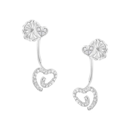 White metal earrings with heart-shaped designs adorned with white gemstones in pave setting, shown from a slightly angled front view.