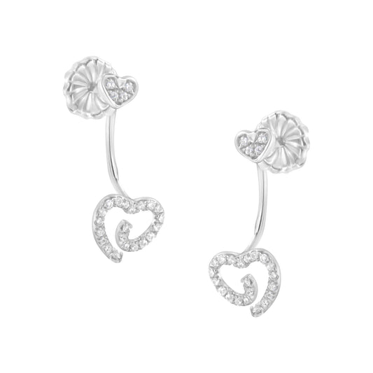White metal earrings with heart-shaped designs adorned with white gemstones in pave setting, shown from a slightly angled front view.