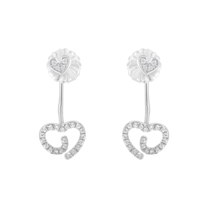 Front view of white metal earrings featuring a small heart with white gemstones at the top connected by a slender bar to a larger open heart shape outlined with white gemstones.