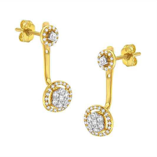 Front angle view of yellow metal drop earrings with two circular sections, each featuring clusters of white round gemstones in prong settings.