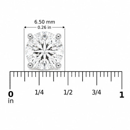 Close-up front view of a white metal round-shaped earring with a white gemstone in a four-prong setting, shown on a ruler scale.