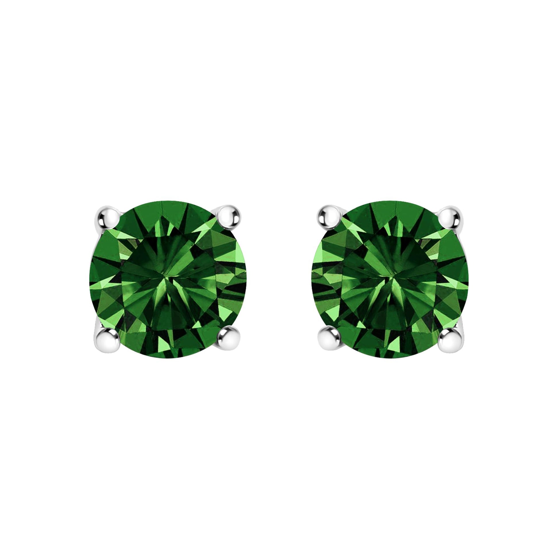 Front-facing close-up of white metal stud earrings, each set with a round green gemstone in a four-prong setting.
