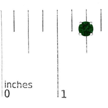 Close-up of a single white metal earring with a round green gemstone in a 4-prong setting, shown on a ruler for size reference.