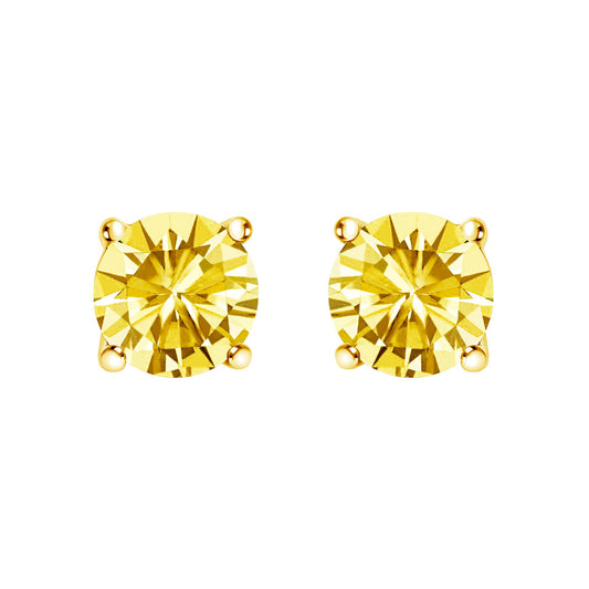 Close-up front angle of a pair of yellow metal stud earrings each featuring a round yellow gemstone set with four prongs.