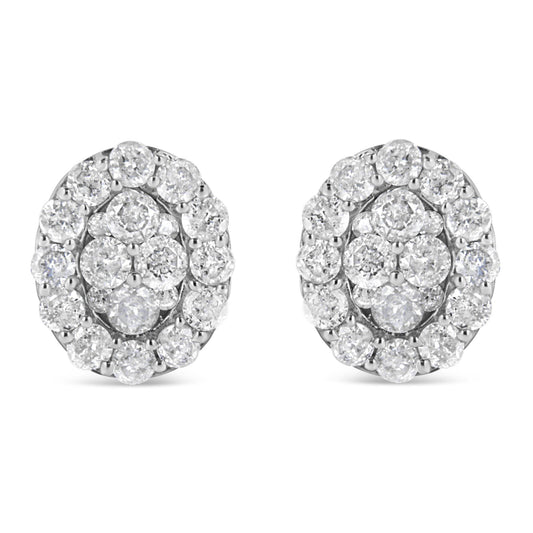 Front view of a pair of white metal stud earrings with round white gemstones in prong settings arranged in a cluster design.