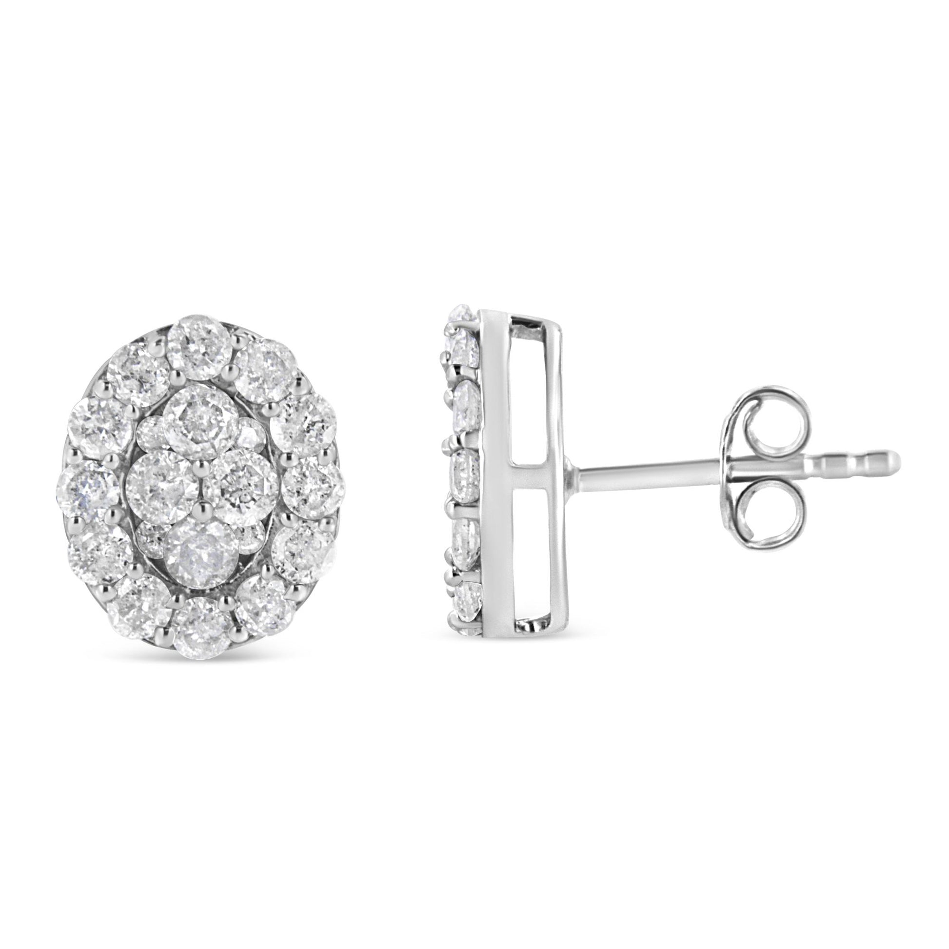 Pair of white metal round cluster stud earrings with prong-set white gemstones, shown from front and side angles.