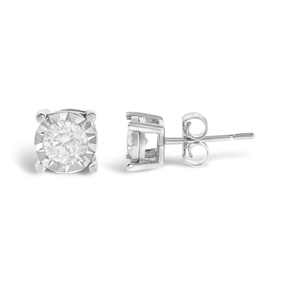 Pair of white metal stud earrings with round white gemstones in miracle setting, shown from front angle on white background.