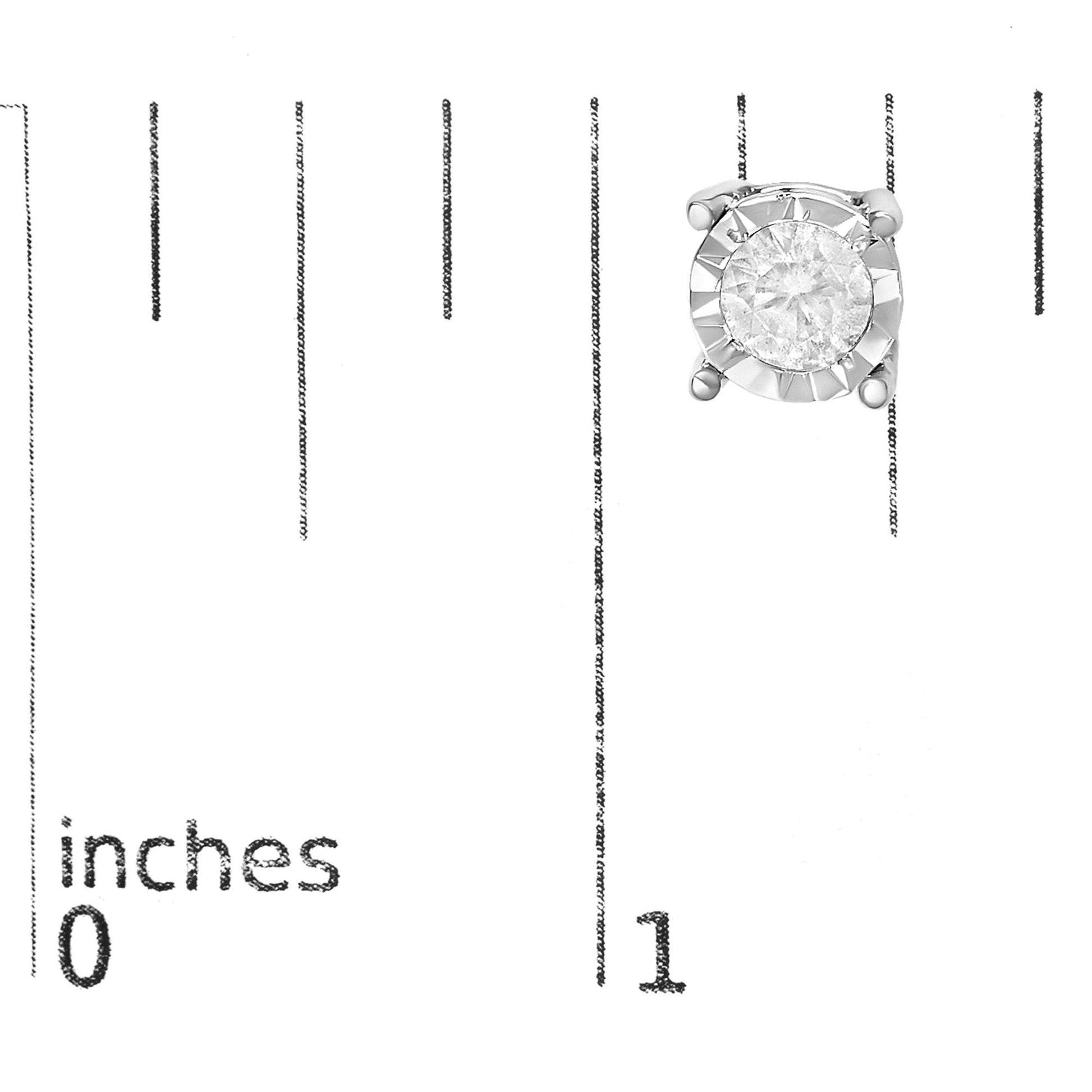 Front-facing image of a pair of white metal stud earrings with round white gemstones in a miracle setting, displayed next to a ruler for size reference.