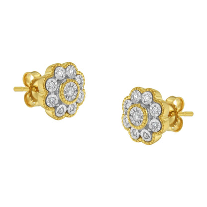 Pair of yellow metal stud earrings with round white gemstones in a floral cluster design, shown at a slight angled front view.