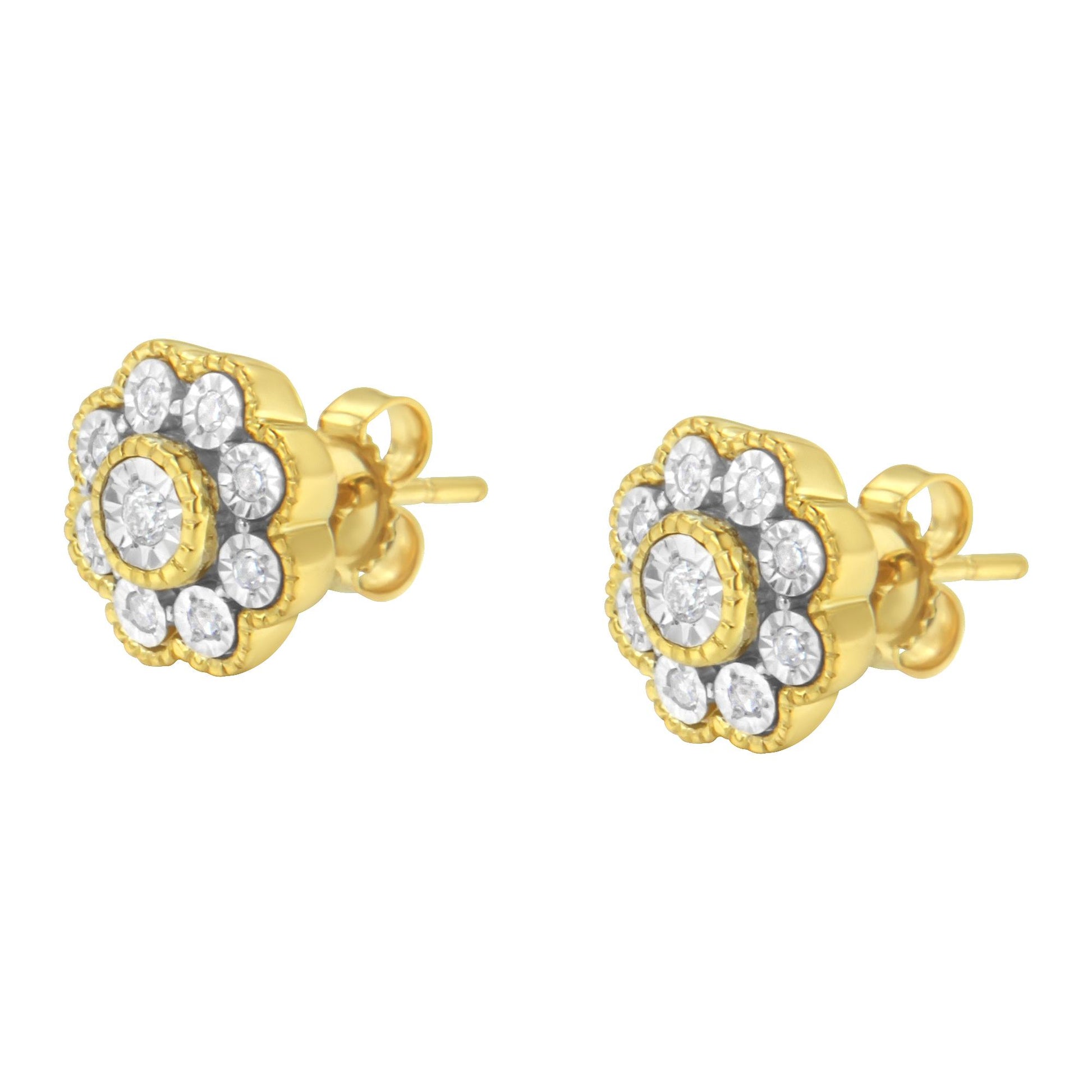 Pair of yellow metal stud earrings with round white gemstones in a floral design, shown from a front angle.
