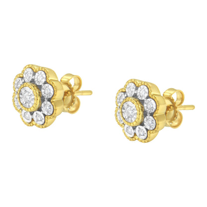 Pair of yellow metal stud earrings with round white gemstones in a floral design, shown from a front angle.