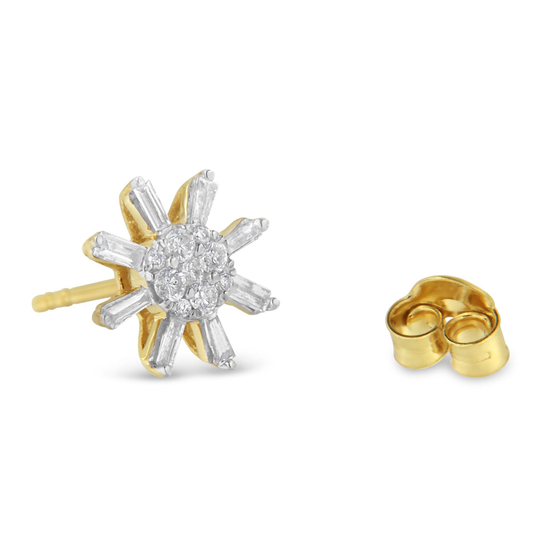 Close-up of yellow metal stud earrings with round and baguette white gemstones in prong settings, shown from a front angled view with one earring back visible.