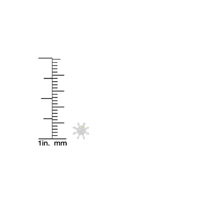 Close-up image of a yellow metal earring with round and baguette-shaped white gemstones, shown next to a ruler for size reference.