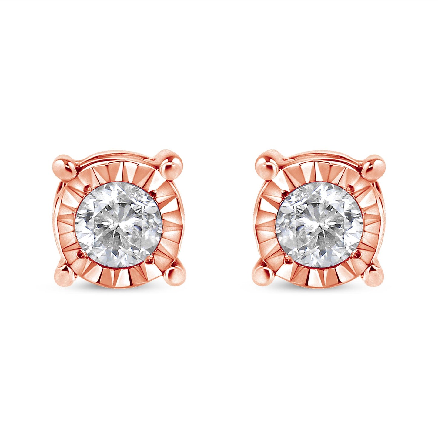 Front view of a pair of rose metal stud earrings each featuring a round white gemstone with a miracle setting.