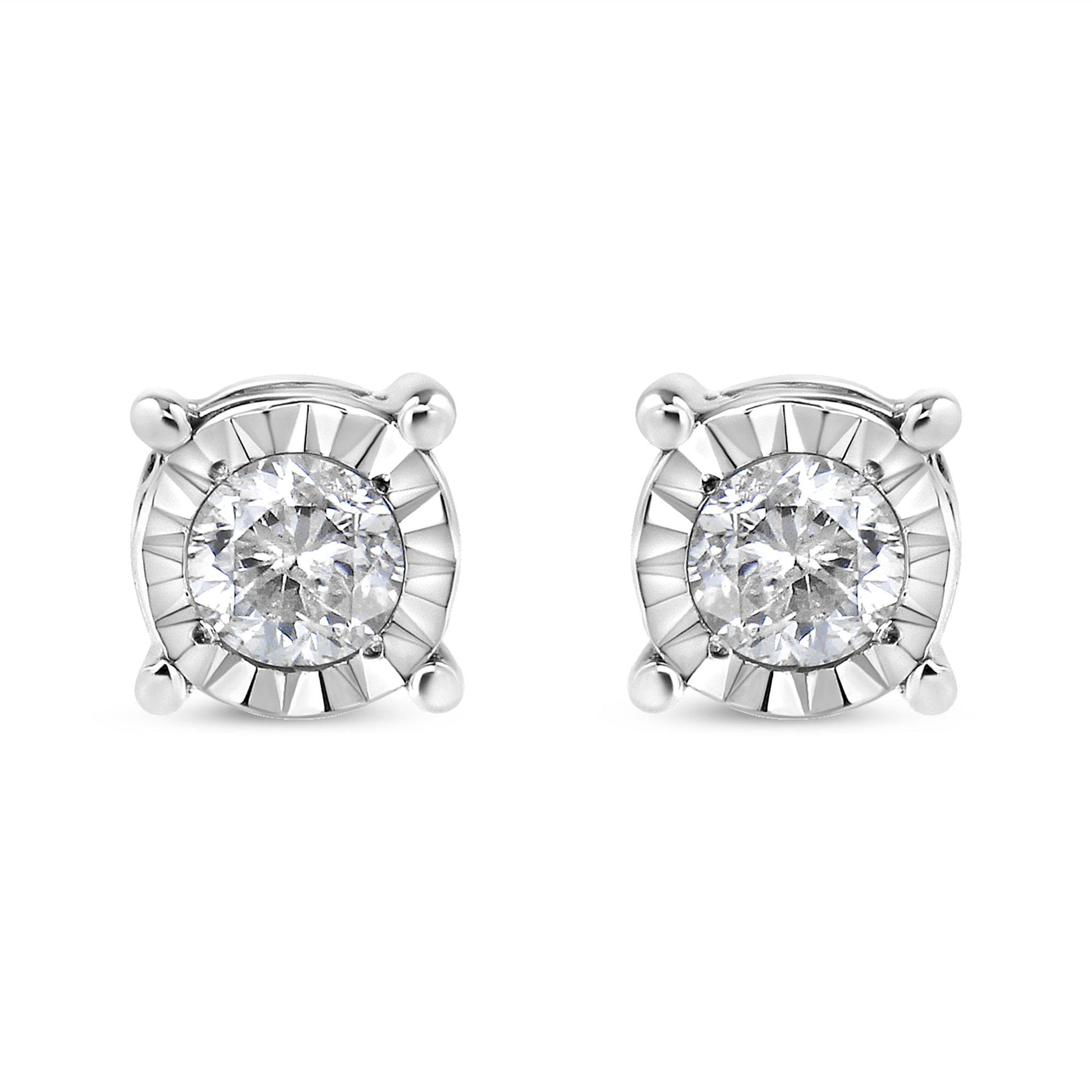 Front view of a pair of white metal stud earrings each featuring a round white gemstone in miracle setting.