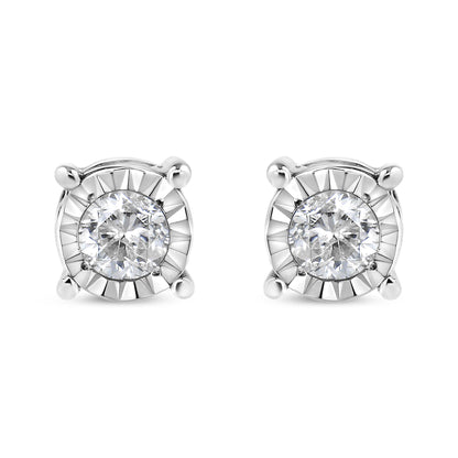 Front view of a pair of white metal stud earrings each featuring a round white gemstone in miracle setting.