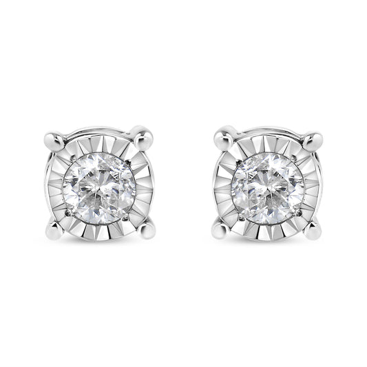 Front view of a pair of white metal stud earrings each featuring a round white gemstone in miracle setting.