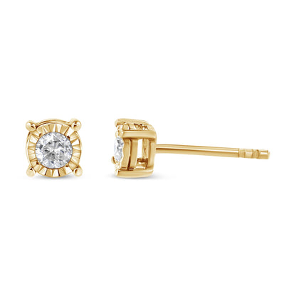 Close-up front and side view of yellow metal stud earrings with a round white gemstone in a miracle setting.