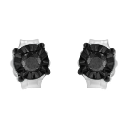 Front angle view of a pair of stud earrings with round black gemstones set in white and black metal.