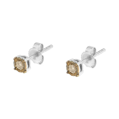 Pair of two-toned stud earrings with round champagne-colored gemstones in miracle settings, shown from a slightly angled front view.